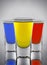 Three cocktails yellow red and blue colors in three wine-gla