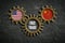 Three cogwheels on slate background with the flags of USA and the China and the words `free trade `