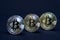 Three coins of bitcoin on black background.