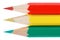 Three color pencils a traffic light concept on white background