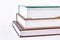 Three colored books on white background.