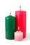 Three colored burning candles. Isolated