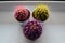 Three colored cacti on the windowsill