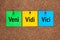 Three colored notes on corkboard with words Veni, vidi, vici