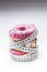 Three colorful donuts wrapped in a tailors measuring tape