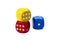 Three colorful game dice stacked, two of them showing six and one showing one isolated on white background. Six and one