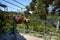 Three colorful gondolas cable cars as they transport people up and down in the Caracol Park