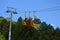 Three colorful gondolas cable cars as they transport people up and down in the Caracol Park, Brazil