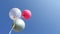 Three colorful helium balloons floating in the blue sky. Birthday celebration.