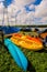 Three Colorful Ocean Kayaks