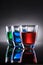 Three Colorful Shot Glasses on Grey Background