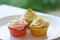 Three colorful springtime cupcakes