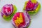 Three colorful tissue paper flowers