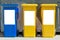 Three colorful trash cans