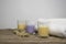 Three coloured candles with white towels