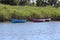 Three Colourful Canoes on the Lake