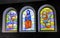 Three colourful stained glass windows