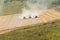 Three combines collects the stubble remains on the cutover field during harvesting