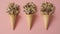 Three cone ice creams formed with a ball of wooden letters