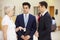 Three Consultants Meeting In Hospital Reception