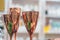 Three copper vessels in the shape of a glass stand on the table