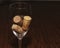 Three Corks in a wine glass left side