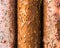 Three corroded rusty metal bars