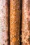 Three corroded rusty metal bars