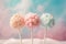 Three cotton candy cake pops on pastel pink and blue background. Generative AI