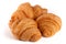 Three croissant isolated on white background closeup