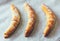 Three croissant on parchment paper close-up