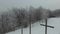 Three crosses on a hill in winter, aerial view