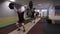 Three CrossFit athletes performing Clean and Jerk exercise