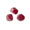 Three crude red ruby stones on white background closeup