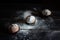 Three cupcakes on a wooden table. Dusted with icing sugar. Place under the text