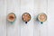 Three cups of coffee symmetrically arranged and ready to share