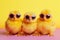 Three cute chicken chicks wearing sunglasses, representing a fun and playful image. Ai generated