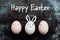 Three cute easter eggs with faces, happy easter bunny background