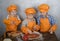 Three cute European boys dressed as cooks are busy cooking pizza. three brothers help my mother to cook pizza