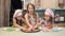 Three cute girls take a cookie from the plate