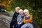 Three Cute Kids Bundled up Tractor Wagon Ride on Chilly Fall Day