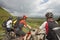 Three Cyclists On Countryside Track