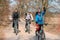 Three cyclists outside the city, spring bike ride