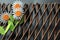 Three Daisy Flowers On Wooden Trellis