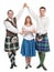 Three dancers in clothing for Scottish dance