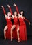 Three dancers in red evening gown