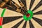 Three darts in bull\'s eye close up