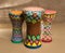 Three decorated colorful pottery goblet drums chalice drum, tarabuka, darbuka