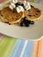 Three delicious blueberry pancakes with whipped topping