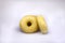 Three Delicious Classic Donuts on White Background